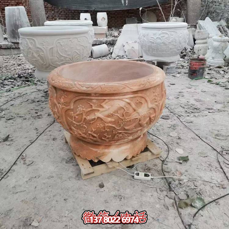 浮雕石雕晚霞景观花盆博鱼平台