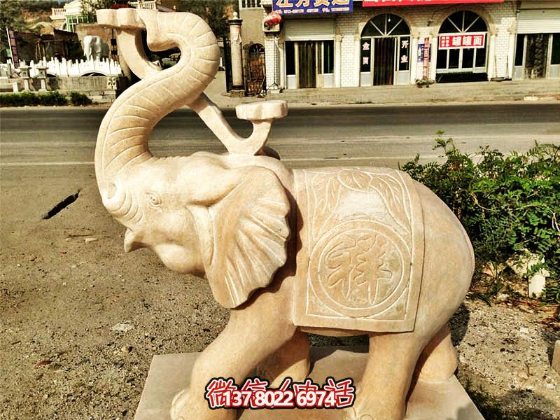 公园景区晚霞红石雕大象博鱼平台