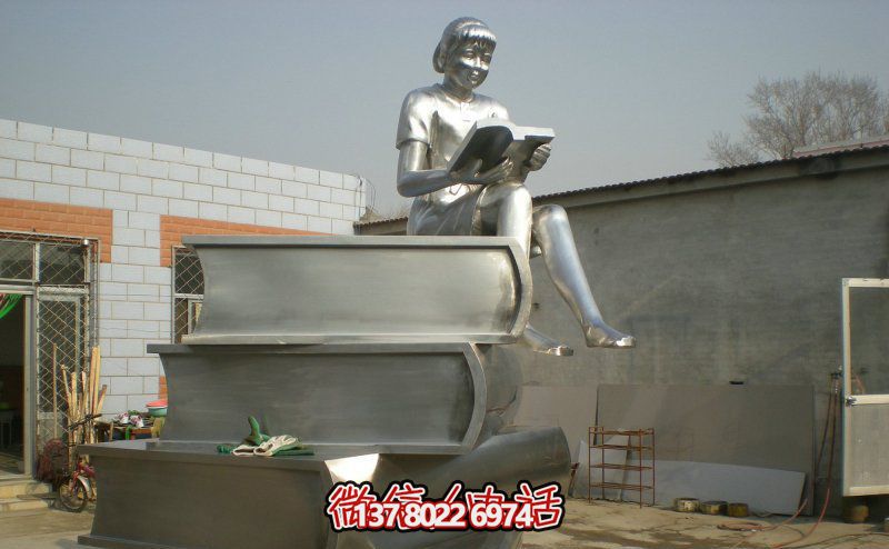 景区玻璃钢女孩坐着书本上的读书博鱼平台